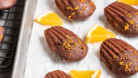 Chocolate Dipped Orange Madeleines - Sprinkle Bakes